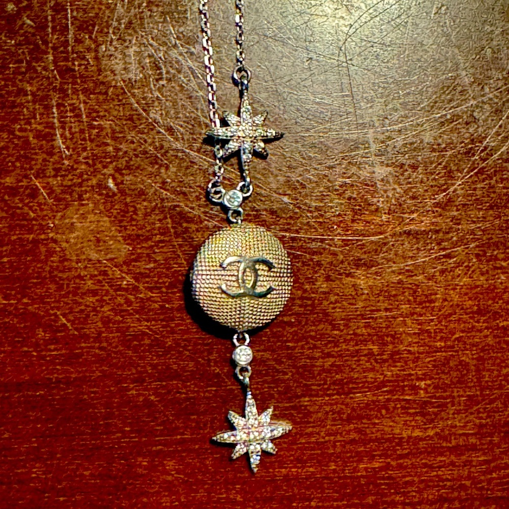 Chanel button silver necklace.